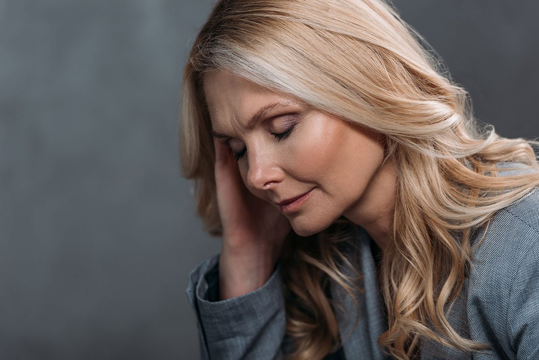 woman with headache, can chiropractic care help with my headaches