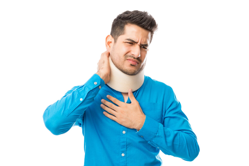 man with whiplash in a neck brace